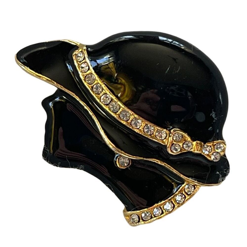 Vintage sophisticated silhouette black enamel rhinestone brooch.